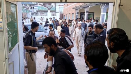 Gunmen target ambulance in Pakistan after suicide bombing at checkpoint killed 12