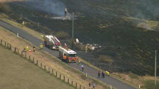 The plane crashed in a field, sparking a grass fire.