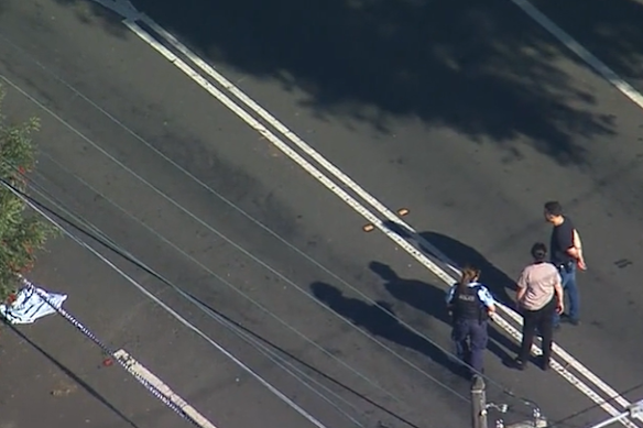 Police monitor the road where the girl was killed on Tuesday afternoon.