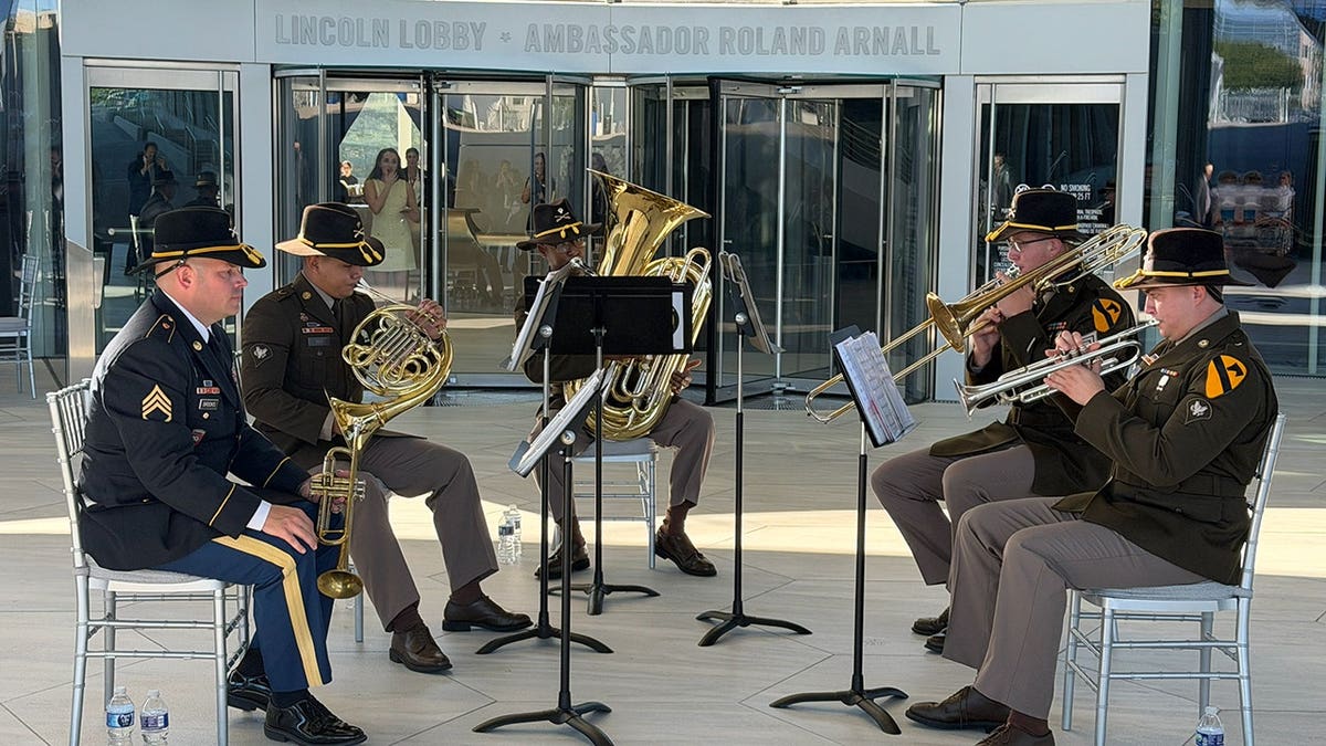 Band performs outside a museum.