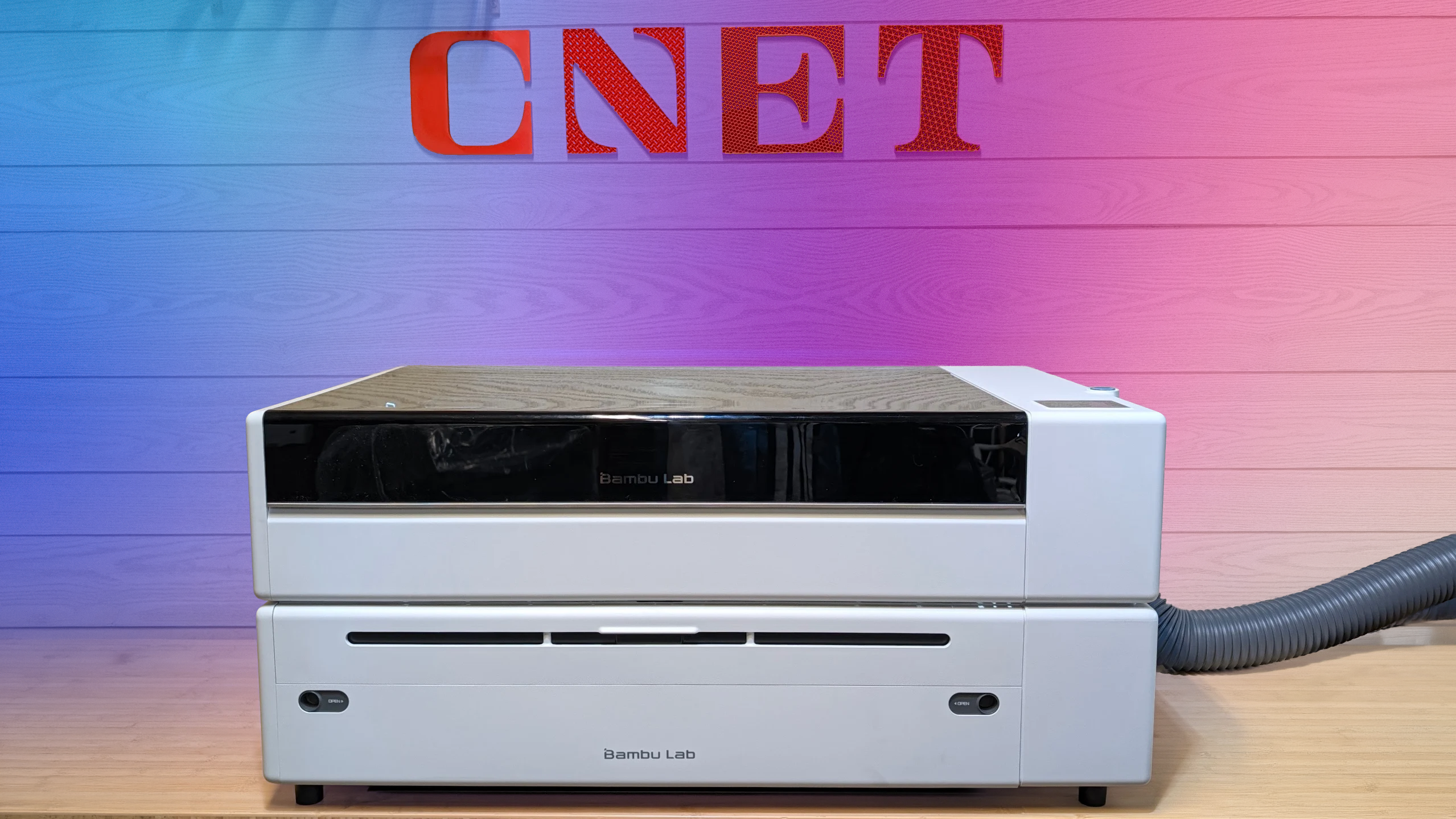 A white CO2 laser with a CNET logo above