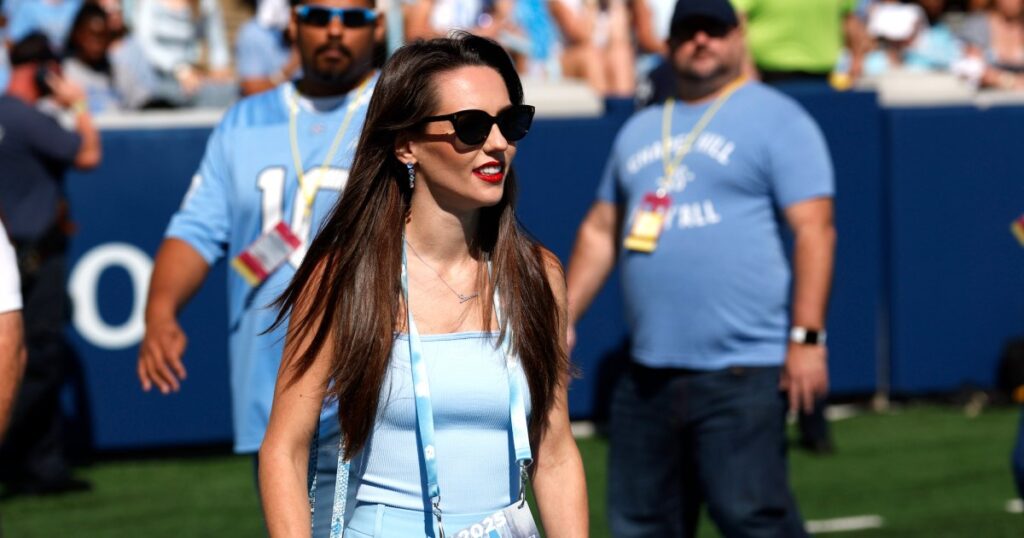 Bill Belichick’s Girlfriend Jordon Hudson Trades Snakeskin for a Jumpsuit While Cheering on UNC