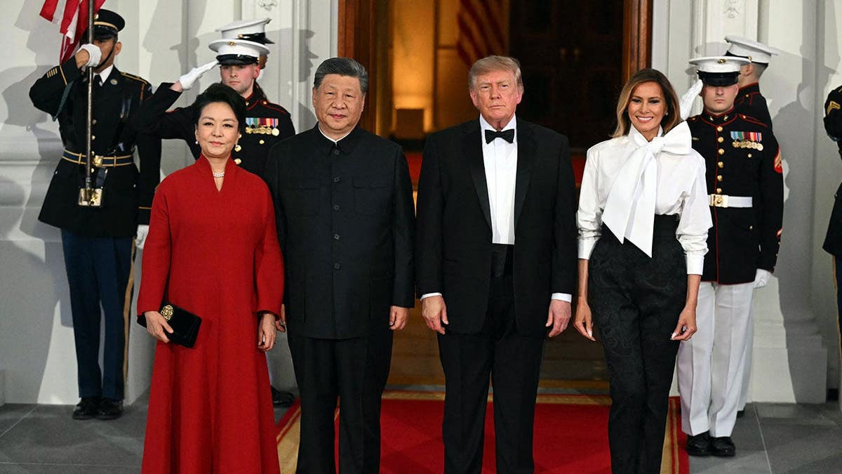 Donald Trump, Xi Jinping, Melania Trump and Peng Liyuan pose on the White House North Portico steps.